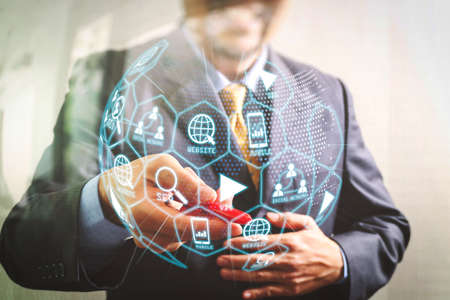 Digital marketing media (website ad, email, social network, SEO, video, mobile app) in virtual globe shape diagram.success businessman open his hand offer pen sign contract,front viewの写真素材