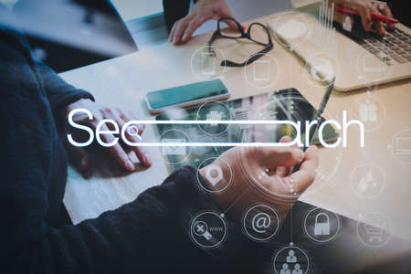 Searching Browsing Internet Data Information Networking Concept with blank search bar.Designer Businessman hand using smart phone,mobile payments online shopping,omni channel.の写真素材
