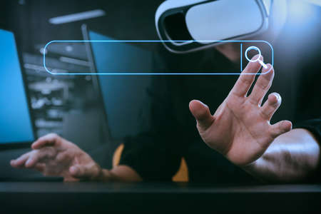 Searching Browsing Internet Data Information Networking Concept with blank search bar.businessman wearing virtual reality goggles in modern office with mobile phone using with VR headsetの写真素材