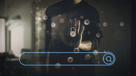 Searching Browsing Internet Data Information Networking Concept with blank search bar.cyber security internet and networking concept.Businessman hand working with VR screen padlock icon on computer backgroundの写真素材