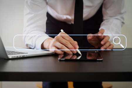 Searching Browsing Internet Data Information Networking Concept with blank search bar.businessman working with digital teblet computer.の写真素材