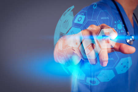 Health care and medical services concept with world or global form and AR interface.Medicine doctor hand working with modern computer interface as medical conceptの写真素材