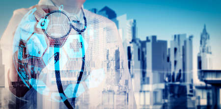 Health care and medical services concept with world or global form and AR interface.Double exposure of smart medical doctor working with abstract city as conceptの写真素材