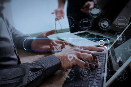 Searching Browsing Internet Data Information Networking Concept with blank search bar.Designer Businessman hand using smart phone,mobile payments online shopping with digital tablet docking keyboard computer.の写真素材