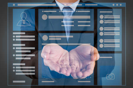 Web page browser of Social media Page VR Interface on the laptop computer. business man with an open hand as showing something conceptの写真素材