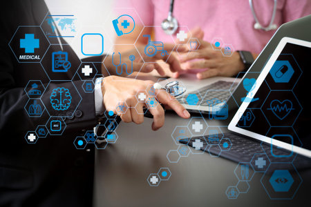 Health care and medical technology services concept with flat line AR interface.Medical co working concept,Doctor working with smart phone and digital tablet and laptop computer to meeting his teamの写真素材