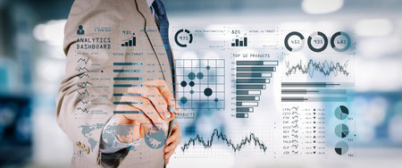 Intelligence (BI) and business analytics (BA) with key performance indicators (KPI) dashboard concept.business documents on office table with smart phone and digital tablet and graph on wide screen computer.の写真素材