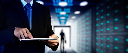 Businessman working with VR wide blank screen computer on server room in background.