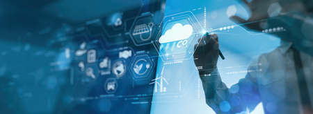 Businessman working virtual modern computer to reduce CO2 emissions carbon footprint climate change to limit global warming.Sustainable development and innovation green business concept.の写真素材