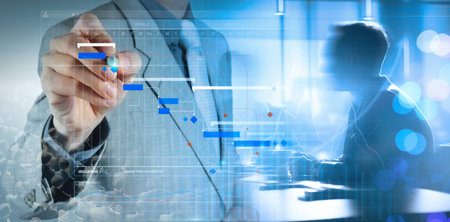 Businessman managing projects and organizing time in critical situations from economic crisis using data analysis report to increase productivity and achieve business goal. Effective time management.の写真素材