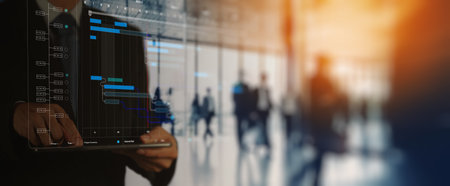 Project manager working tablet and update tasks with milestones progress planning and professional investor working new start up project in the officeの写真素材