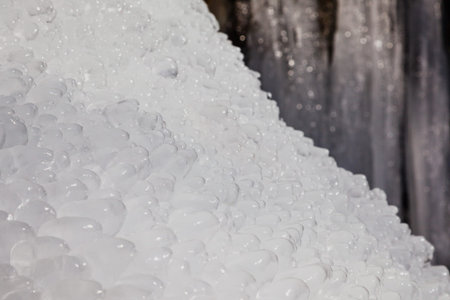 Fragment of a frozen waterfall, icicles of a winter waterfall.の写真素材