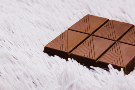 Chocolate on the background fabric, copy space, close up.