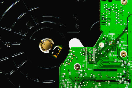 The chip of the hard disk controller with soldered elements, close up.の写真素材