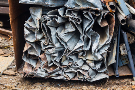 Scrap yard, pressing non-ferrous scrap metal into a cube.
