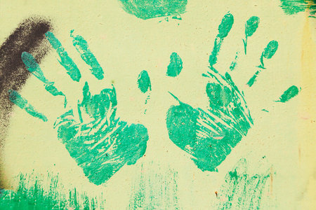 Handprints on the metal surface.