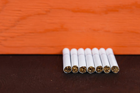 Close up cigarette on red background, Quit Smoking, Stop Smoking Cigarette Concept. Copy space.の写真素材