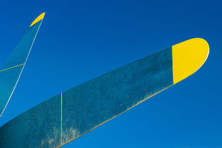 The blade of a piston plane against the blue sky.の写真素材