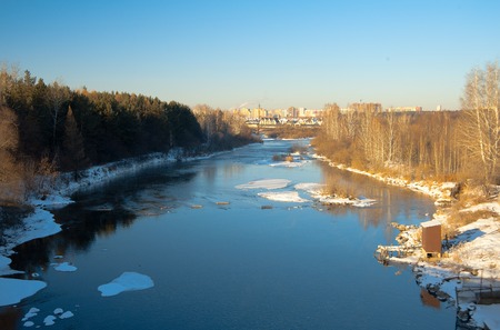 The river Miass in winter. View from the bridge between the streetsの写真素材