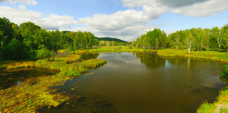 Slowly the current river in early autumnの写真素材