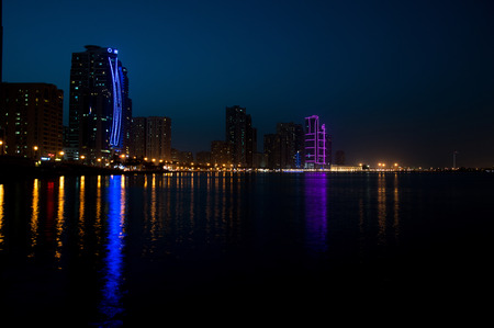 Sharjah downtown night scene with city lights, luxury new high tech town in middle Eastのeditorial素材