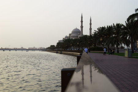 Sharjah city mosque with gulf, bridge and palms, conctruction and modern architecture concept. Islam. Unated Arab Emiratesのeditorial素材