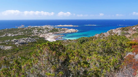 Marine waves hurry ashore, struck at off-shore stone, and washing off sand at-sea.の写真素材