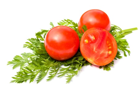 Mature mouth-watering tomatoes close-up on white backgroundの写真素材