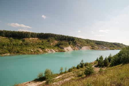 chalk quarry with blue waterの写真素材