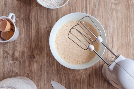 Whipped the dough in a porcelain bowlの写真素材