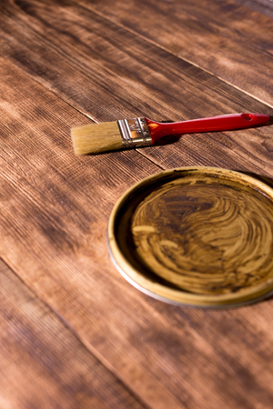 brush and jar cover on wooden backgroundの写真素材