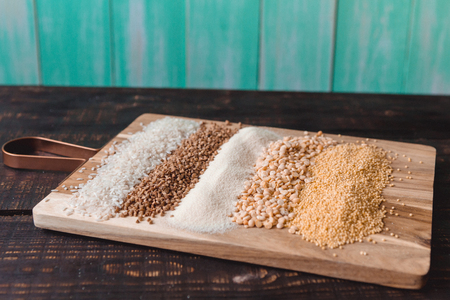 scattered groats in a row on a cutting boardの写真素材