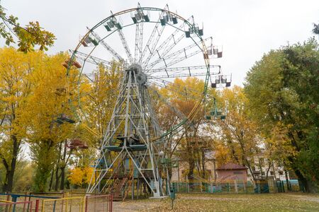 Ferris wheel at the amusement park in autumnの写真素材