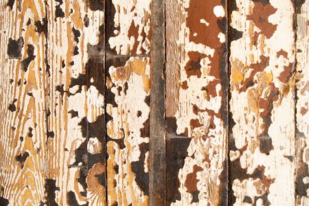 wooden floor with peeling old brown paintの写真素材
