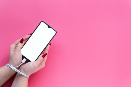 Close up woman's hands having modern smartphone, empty screen for your text or design. Hands bound...