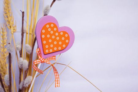 Postcard with fresh with willow twigs and decorative heart.の写真素材