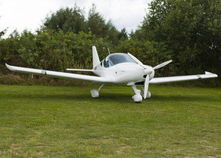 White sailplane on an airfield take off.