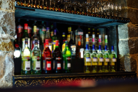 blur background a bottle of liquor in a barの写真素材