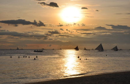Sailboats against beautiful sunset in Boracay.の写真素材