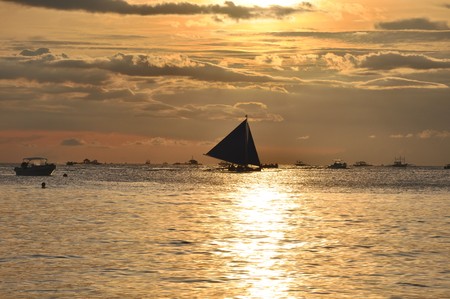 Sailboat against beautiful sunset in Boracay.の写真素材