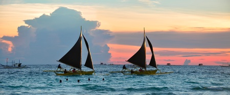 Sailboats against beautiful sunset in Boracay.  Philippines の写真素材