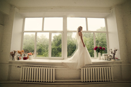 Bride at the windowの写真素材