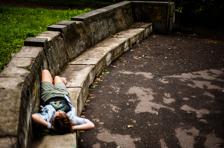Alone in the park. Teenager thinkingの写真素材