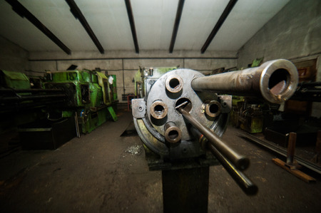 A machine inside some old factory. It does not work but still stands thereの写真素材