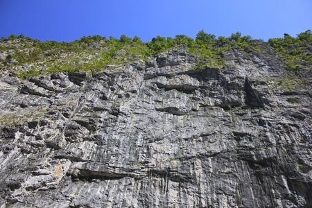 High rocky cliff, bottom viewの写真素材