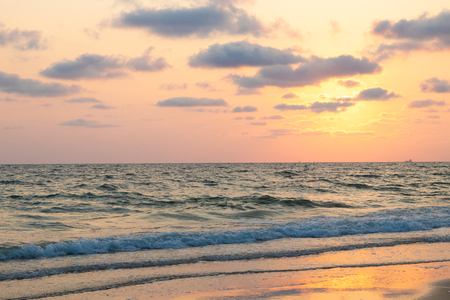 Beautiful pink sunset over sea on the beach, background.の写真素材