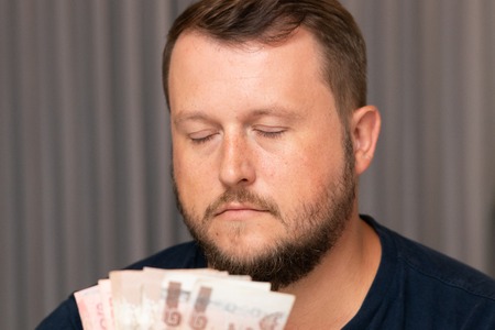 Businessman hand grabbing money, Thai Baht. transfer money.の写真素材