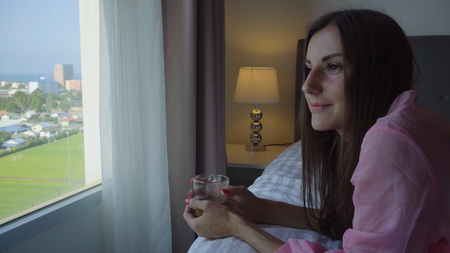 the girl opens the wardrobe, there are no clothes and a dress in the wardrobe, the female is surprised and sad.の写真素材