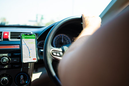 male driving a car on the road using a new, concept of traveling by car, gps