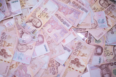 Close up Thai money banknotes closeup background, Thailand money for business, coins. 1000 task butts.の写真素材